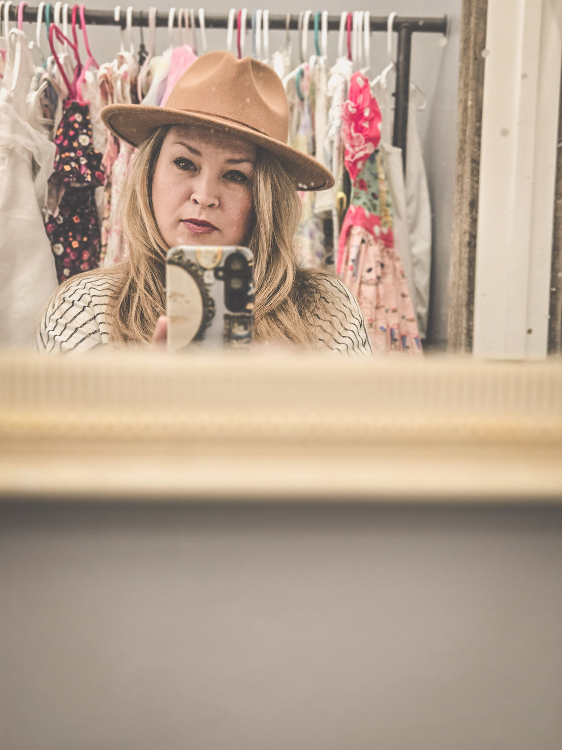 Self-portrait of the Vintage Hearts Club founder wearing a classic vintage hat, capturing timeless charm and old-soul elegance.