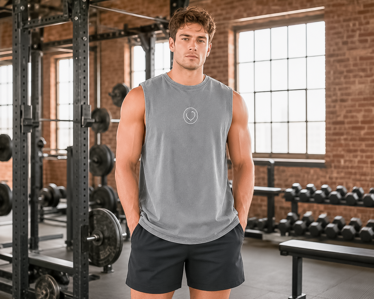 Wide-angle front view of Ash Stone Dragon Slayer stonewash tank top with small Vintage Hearts Club chest emblem